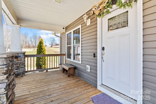 wooden deck featuring covered porch