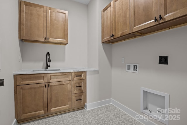 laundry area featuring cabinet space, baseboards, hookup for an electric dryer, washer hookup, and a sink