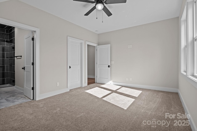 unfurnished bedroom with light carpet, ceiling fan, and baseboards