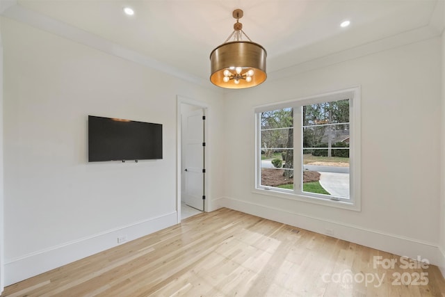 empty room with recessed lighting, baseboards, wood finished floors, and ornamental molding