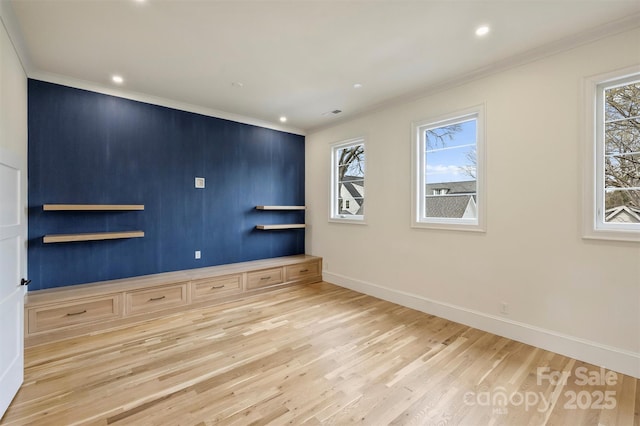 unfurnished room featuring recessed lighting, crown molding, baseboards, and wood finished floors