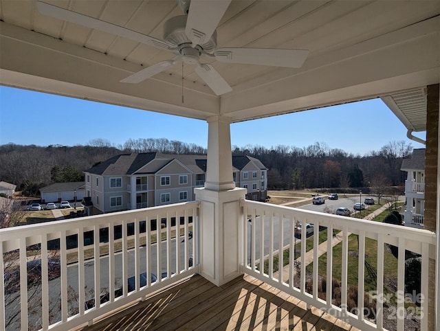 wooden terrace with a ceiling fan