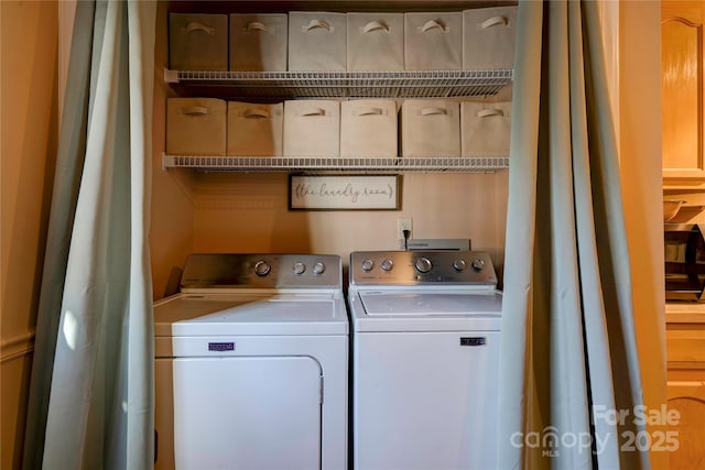 clothes washing area with laundry area and separate washer and dryer