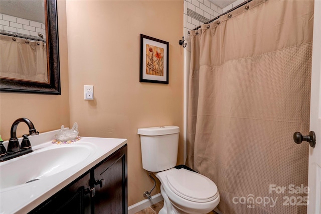 bathroom with vanity, toilet, and a shower with curtain