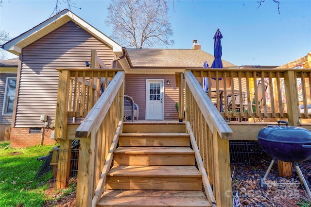 exterior space featuring a grill and stairs