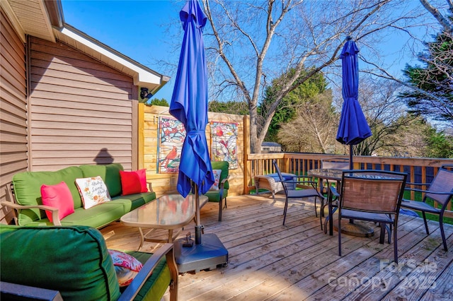 deck featuring outdoor dining area