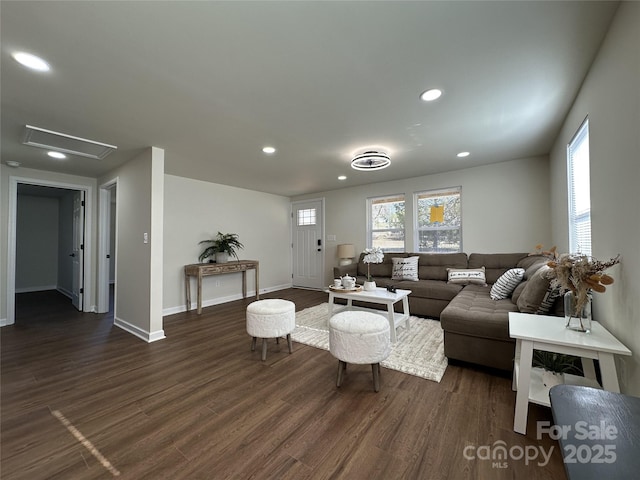 living room featuring dark wood-style floors, recessed lighting, and baseboards