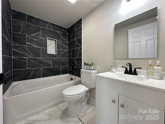 full bath with marble finish floor, shower / bathing tub combination, vanity, and toilet