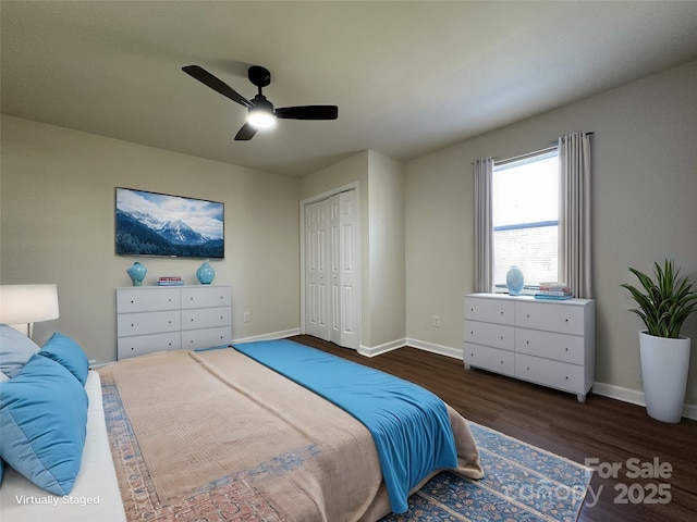 bedroom with a ceiling fan, a closet, baseboards, and wood finished floors