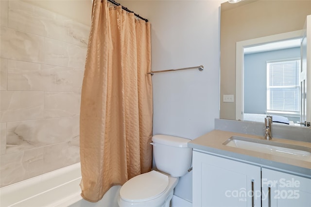 full bathroom featuring vanity, toilet, and shower / bath combo with shower curtain