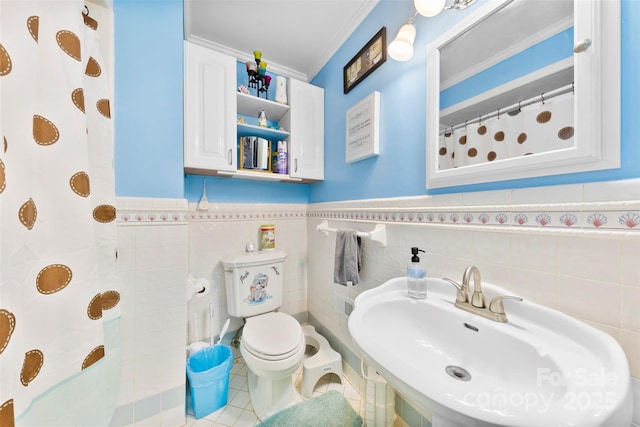 4937 Lebanon Dr Unit 1, Charlotte, NC 28273 - full bathroom with tile walls, ornamental molding, a wainscoted wall, tile patterned flooring, and a shower with shower curtain
