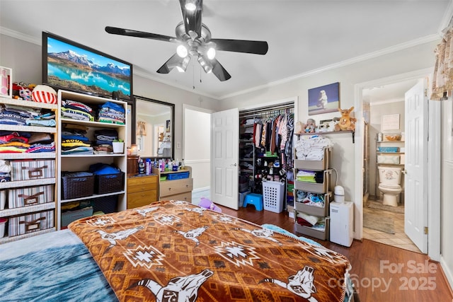 4937 Lebanon Dr Unit 1, Charlotte, NC 28273 - bedroom featuring crown molding, wood finished floors, a closet, and ceiling fan