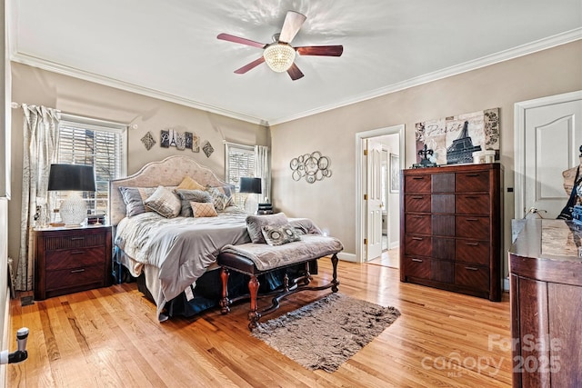 bedroom with light wood-style floors, ornamental molding, baseboards, and a ceiling fan