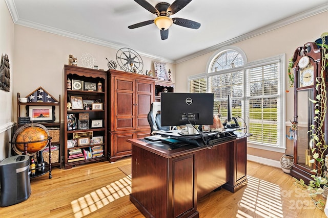 office area with light wood-style floors, ceiling fan, ornamental molding, and baseboards