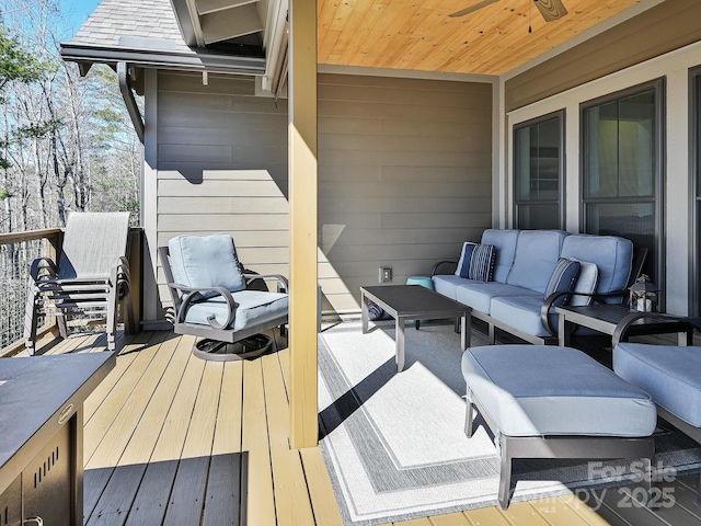 wooden deck with outdoor lounge area