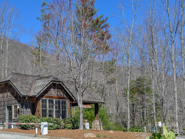 exterior space featuring a view of trees