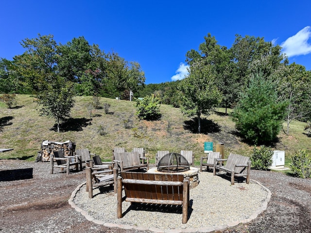 view of yard featuring a patio and a fire pit