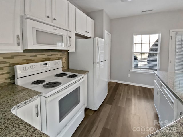 kitchen with light stone countertops, white appliances, white cabinets, and decorative backsplash