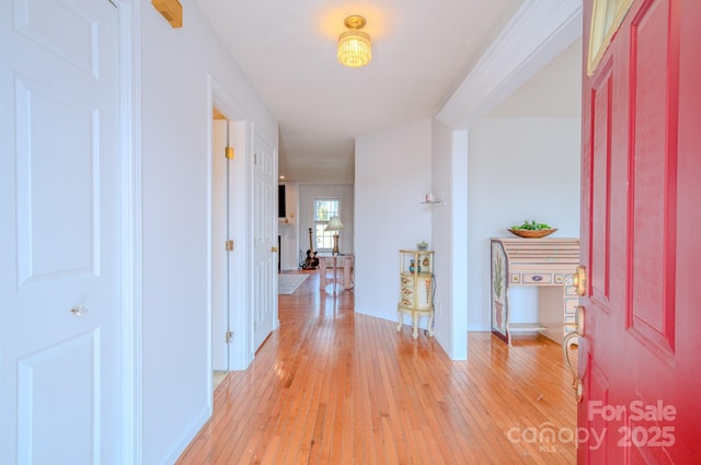 corridor with light wood finished floors