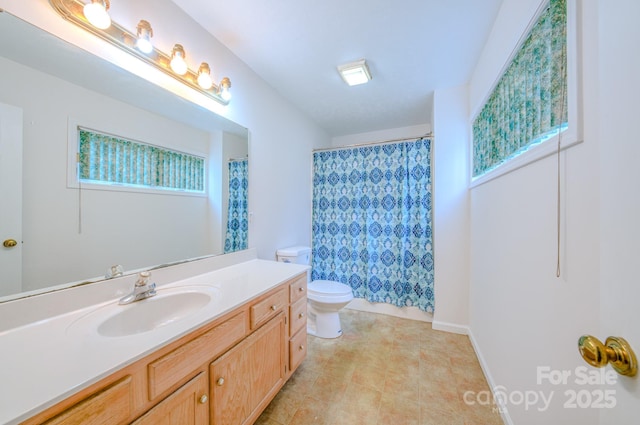 full bath with a shower with shower curtain, toilet, a healthy amount of sunlight, vanity, and tile patterned flooring