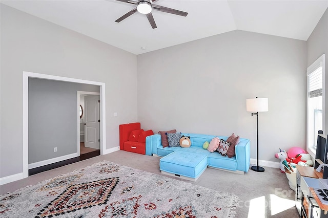 sitting room with lofted ceiling, ceiling fan, carpet, and baseboards