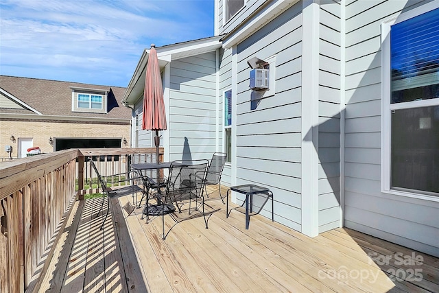 deck featuring outdoor dining area