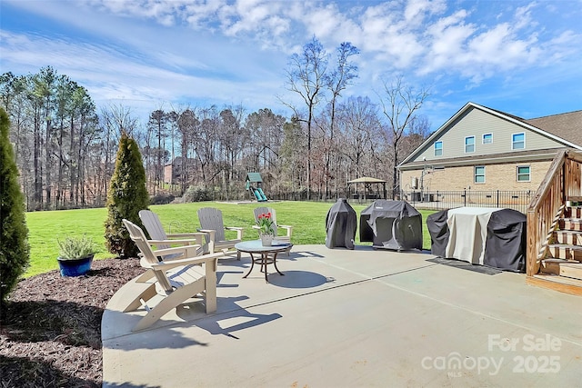 view of patio / terrace featuring stairway, a playground, and grilling area