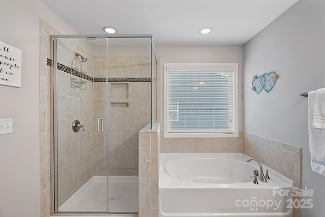 full bath with a shower stall and a bath