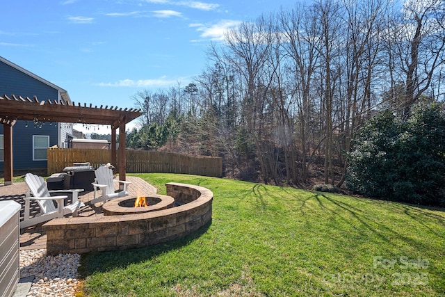 view of yard with an outdoor fire pit, fence, a pergola, and a patio