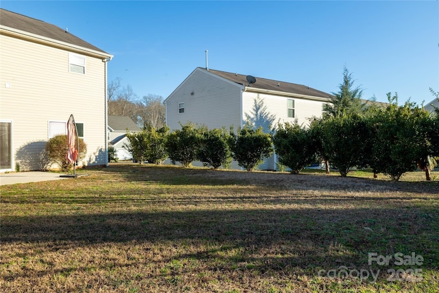 view of property exterior with a lawn