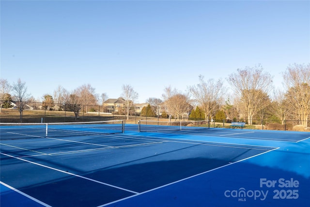 view of sport court with fence