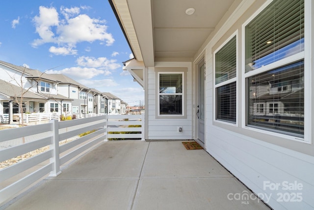 balcony featuring a residential view