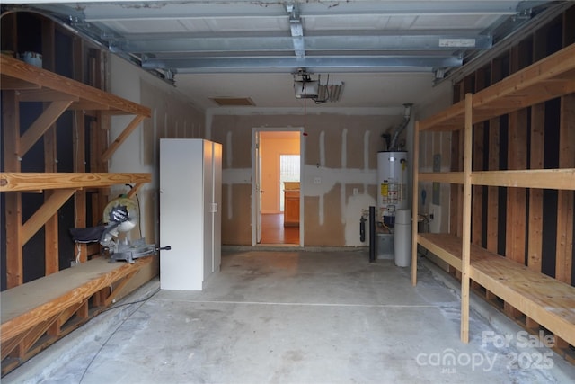 garage featuring a garage door opener and gas water heater