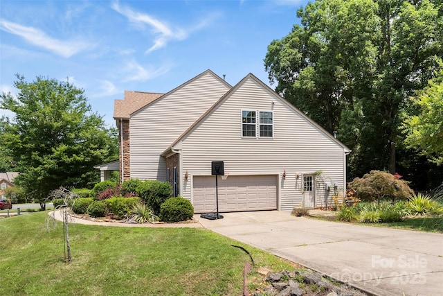 329 Squirrel Ln, Clover, SC 29710 - view of home's exterior with driveway, a yard, and a garage