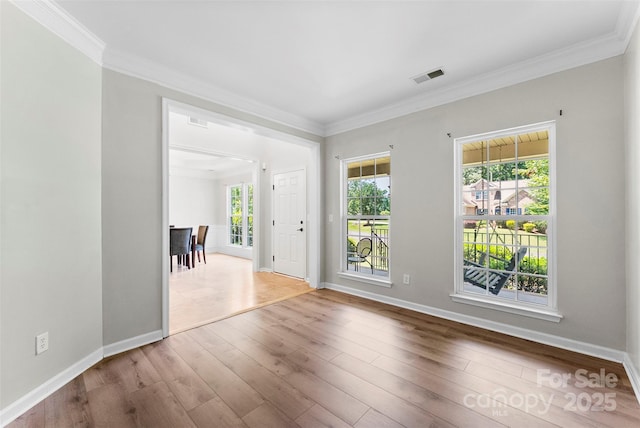 329 Squirrel Ln, Clover, SC 29710 - empty room featuring ornamental molding, healthy amount of natural light, and wood finished floors