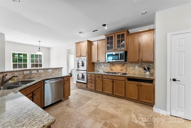 329 Squirrel Ln, Clover, SC 29710 - kitchen with stainless steel appliances, brown cabinetry, tasteful backsplash, and recessed lighting
