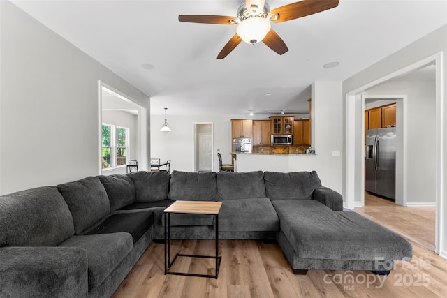 329 Squirrel Ln, Clover, SC 29710 - living room featuring light wood finished floors and a ceiling fan