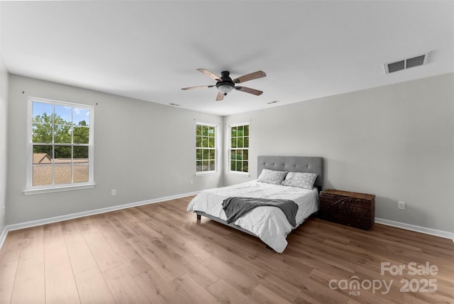 329 Squirrel Ln, Clover, SC 29710 - bedroom with wood finished floors and ceiling fan