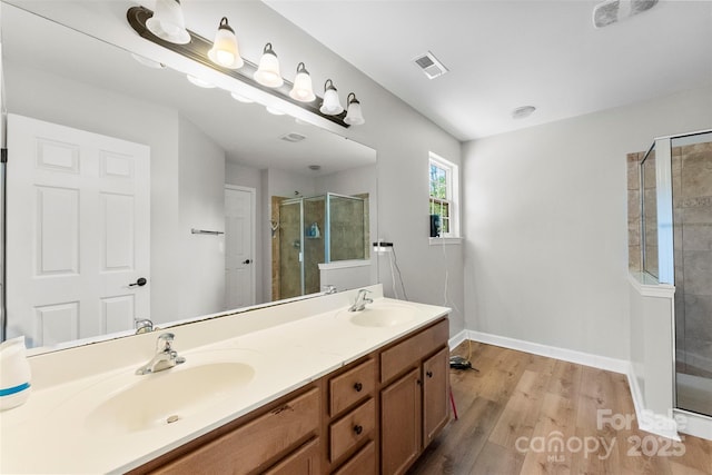 329 Squirrel Ln, Clover, SC 29710 - full bath with a stall shower, double vanity, and wood finished floors