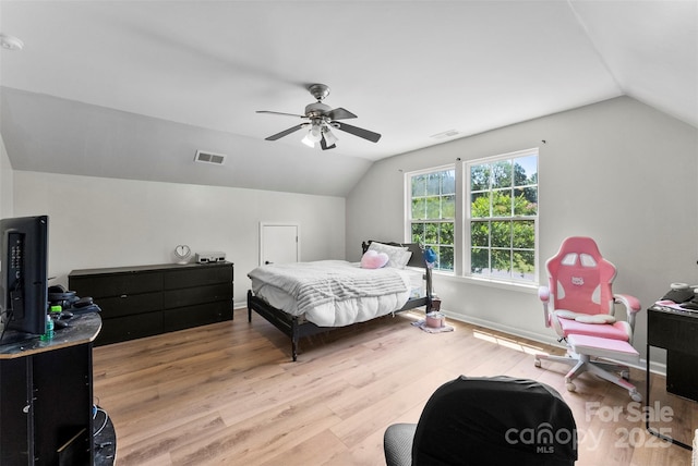 329 Squirrel Ln, Clover, SC 29710 - bedroom with vaulted ceiling, a ceiling fan, and light wood-style flooring