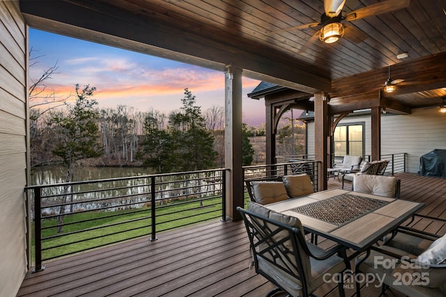 wooden deck featuring a ceiling fan, outdoor dining space, and area for grilling