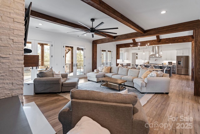 living room with french doors, wood finished floors, beam ceiling, and recessed lighting