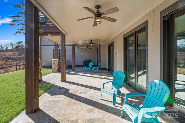 view of patio featuring ceiling fan