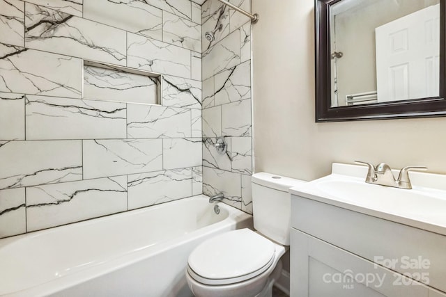 bathroom featuring toilet, vanity, and washtub / shower combination