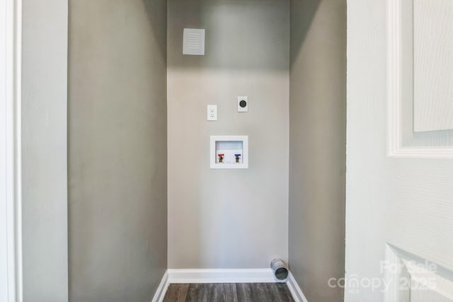 clothes washing area featuring dark wood-style floors, baseboards, washer hookup, and electric dryer hookup