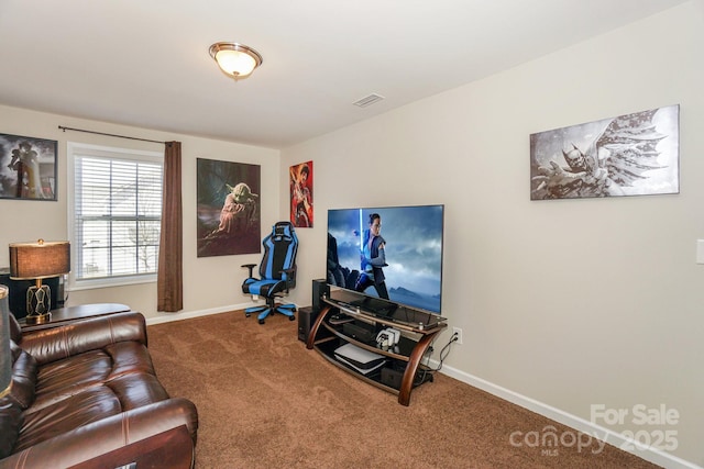 living room with carpet, visible vents, and baseboards