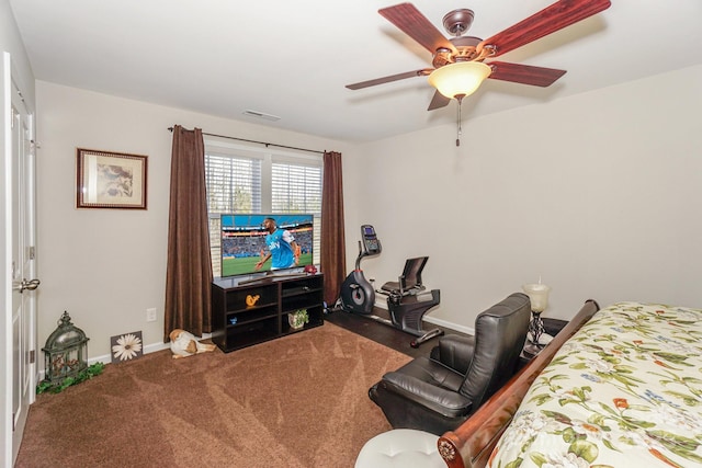 carpeted living area with visible vents, ceiling fan, and baseboards