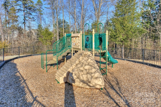 communal playground featuring fence