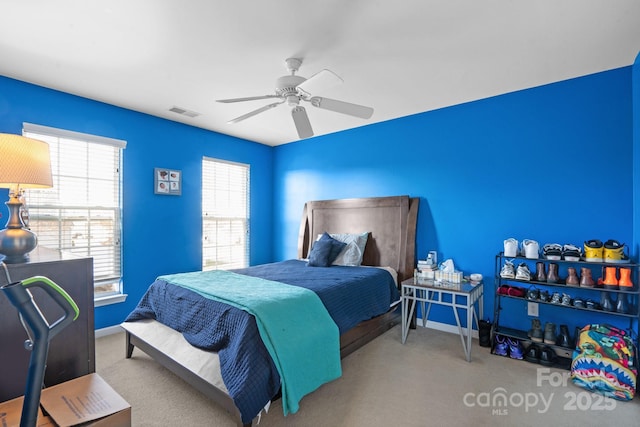 bedroom with visible vents, carpet, a ceiling fan, and baseboards