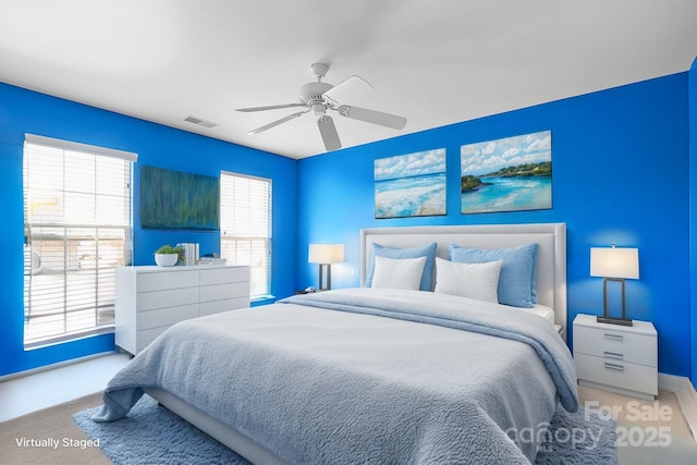 bedroom with a ceiling fan and visible vents